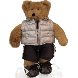 Build-A-Bear Bear with soccer  shorts, cleats and puffy vest.